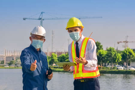 Team engineer Two man architect on a building construction siteの写真素材