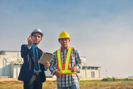 Team engineer Two man architect on a building construction siteの写真素材