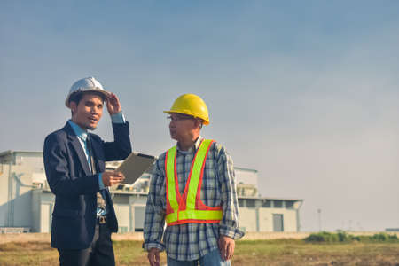 Asian engineer construction team checking work for control and management in the construction site or building siteの写真素材