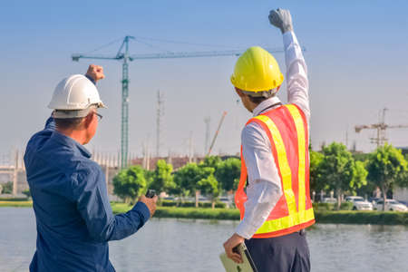 Asian engineer construction team checking work for control and management in the construction site or building siteの写真素材