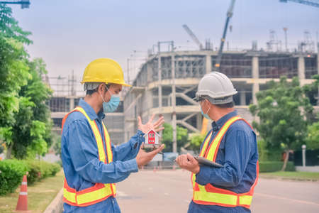Asian engineer construction team checking work for control and management in the construction site or building siteの写真素材