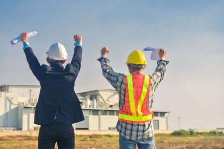 Asian engineer construction team checking work for control and management in the construction site or building siteの写真素材