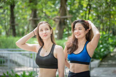 Young woman practicing yoga lotus in asana outdoor, Young woman doing yoga in morning parkの写真素材