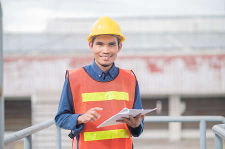 Asia Engineer standing pose Confident , Asian man engineer are working in factory production industrialの写真素材