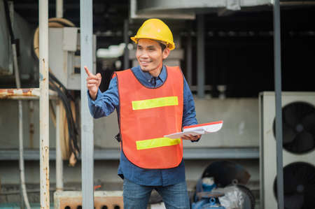 Asia Engineer standing pose Confident , Asian man engineer are working in factory production industrialの写真素材