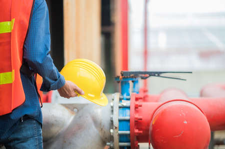 Engineer holding hard hat construction worker professional safety work industry building person manager serviceの写真素材