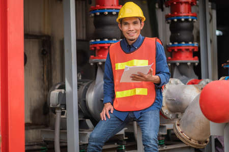 Asian man engineer are working in factory and checking safety system control on production industrialの写真素材