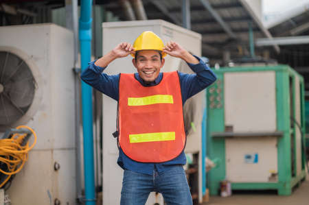 Asia Engineer standing pose Confident , Asian man engineer are working in factory production industrialの写真素材