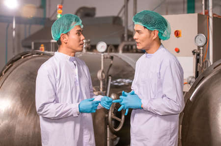 Asian  man employee working in food Factory industryの写真素材