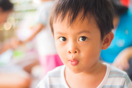 Kid in action  isolated on white backgroundの写真素材