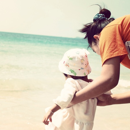Mother and daughter at the beachの素材