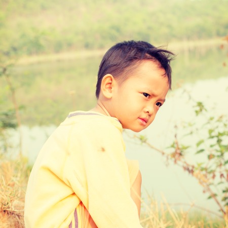 Little boy  with retro filter effectの写真素材
