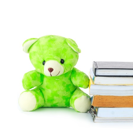 Green teddy Bear and a Bookの写真素材