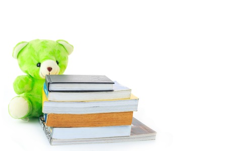 Green teddy Bear and a Bookの写真素材