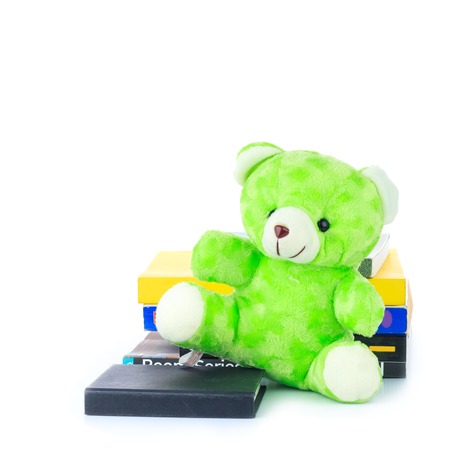 Green teddy Bear and a Bookの写真素材