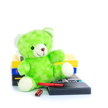 Green teddy Bear and a Bookの写真素材