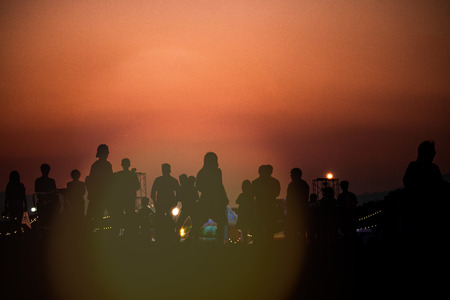 silhouettes of people taking pictures with smartphoneの写真素材