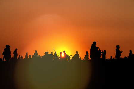 silhouettes of people taking pictures with smartphoneの写真素材