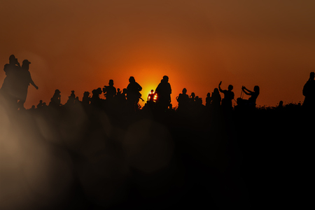 silhouettes of people taking pictures with smartphoneの写真素材