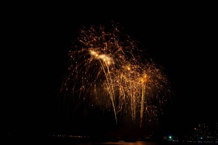 Beautiful colorful fireworks display on the sea beach, Amazing holiday fireworks party or any celebration event in the dark sky.の写真素材