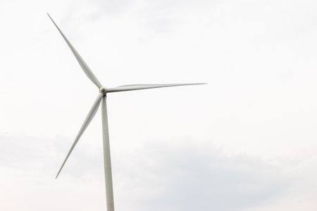 Wind turbine farm power generator in beautiful nature landscape for production of renewable green...