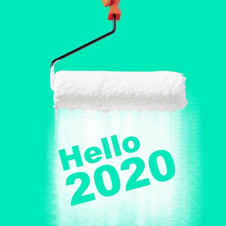 Happy New Year concept, Paint roller, paint on the green color show the textの写真素材