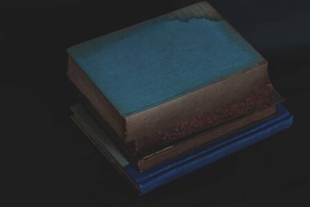 Old vintage books on dark background.の写真素材