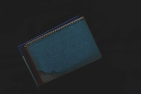 Old vintage books on dark background.の写真素材