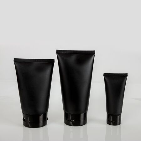 black cosmetic tube cream lotion facial foam sunscreen makeup beauty cosmetic foundation with backgroundの写真素材