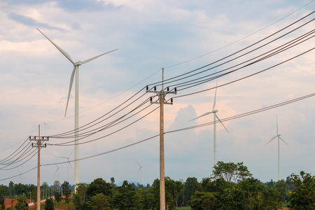 Wind turbine farm power generator in beautiful nature landscape for production of renewable green...