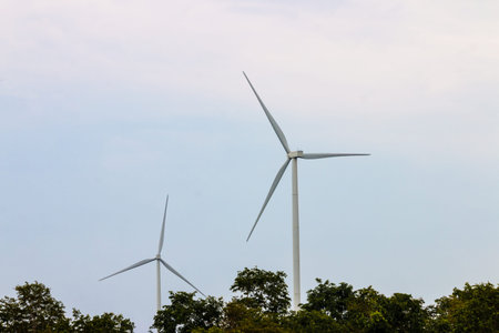 Wind turbine farm power generator in beautiful nature landscape for production of renewable green...