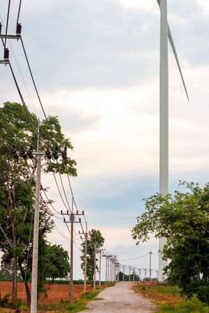 Wind turbine farm power generator in beautiful nature landscape for production of renewable green energy is friendly industry to environment.の写真素材