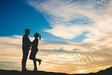 Luscious lovers in the beautiful sunset sky, Concept of love on valentines dayの写真素材