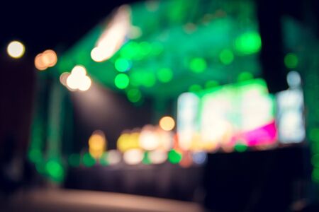 Blurred images of the concert stage full of bokeh lights at night.の写真素材