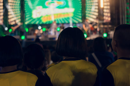 The youth in the concerts have very bright lights at night.