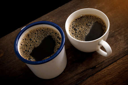 Cup of coffee on old wooden tableの写真素材