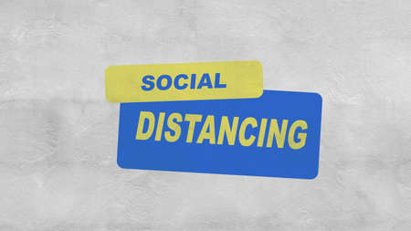 "SOCIAL DISTANCING" Paint text on the cement wallの写真素材