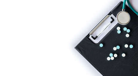 Stethoscope on file folder and pill , The concept of medicine and medical treatment