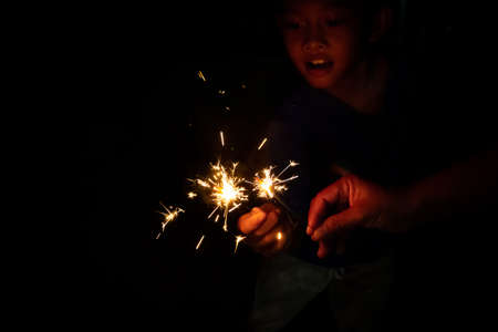 Lighting and glittering light with a cheerful child, fun at the party.の写真素材