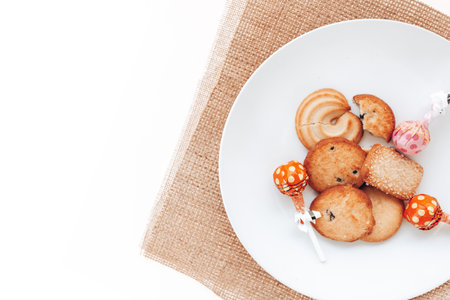 Butter cookies in a white plate on a white background.の写真素材