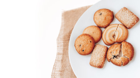 Butter cookies in a white plate on a white background.の写真素材