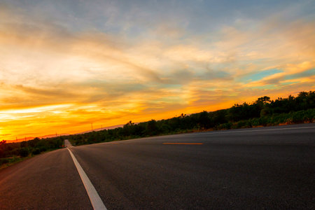 The road in the valley at the time of the sunset Concept of vacation and travelの写真素材