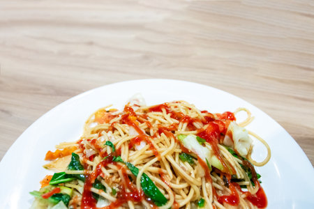 Spaghetti cooked in Thai style, hot and spicy.の写真素材