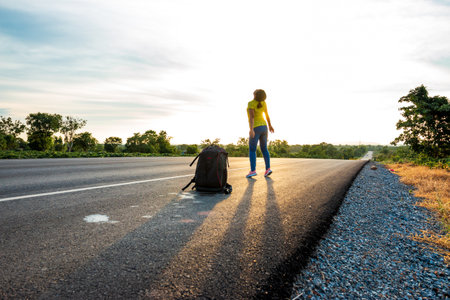 Happy woman jump At the time of the sun set Concept of vacation and travelの写真素材