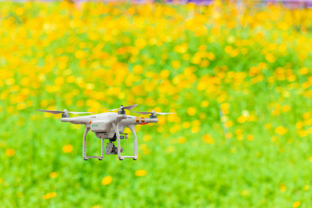 Smart farmer concept, drone flying above farmland.