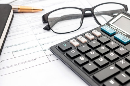 calculator and documents for working on the table, Finance and savings, Business concept.の写真素材