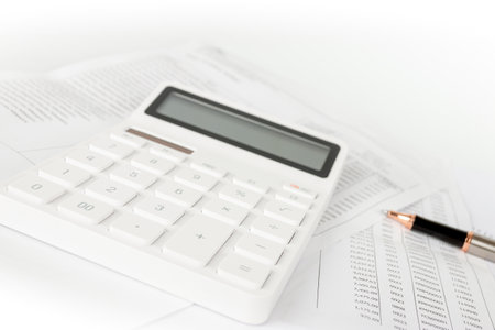 Business startup analysis summary report and using a calculator to calculate the numbers. Financial conceptの写真素材