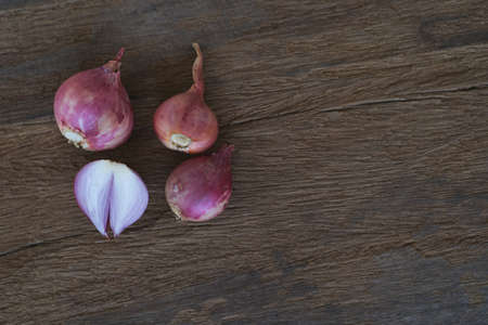 Onion and garlic for cooking on old wooden backgroundの写真素材