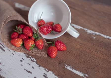 Strawberry on old wooden background, love and valentine themeの写真素材