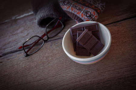 Valentine dark chocolate on old wooden backgroundの写真素材